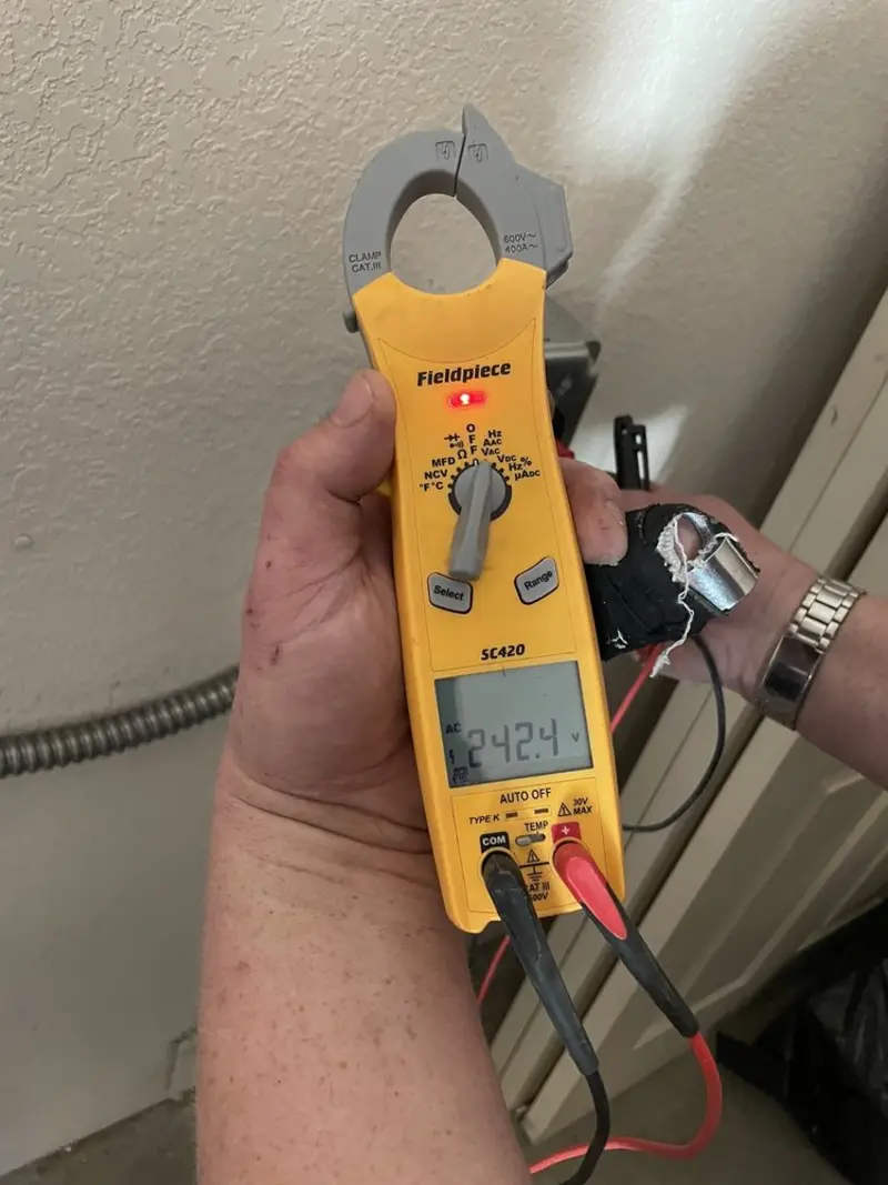 Voltage testing with clamp meter during Aluminum Wiring Replacement in Grattan